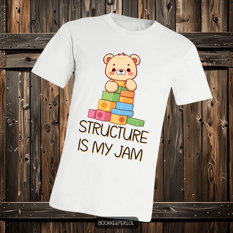Funny Bear Cub T-Shirt: A cheerful character meticulously stacking colorful blocks into a tall tower, representing focus and playful accomplishment.